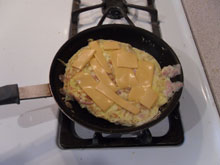 Cooking omelette with cheese added