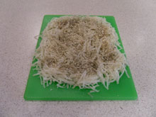 Shredded potatoes with seasoning added